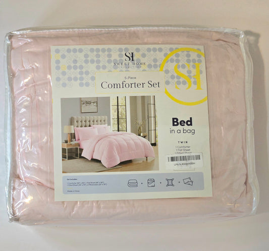 Pink comforter set in packaging with a label on a white background