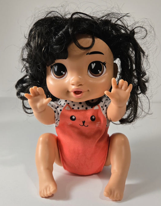 Baby Alive Crawl 'n Play Katie Kat Doll with black hair crawling across floor – interactive toy for toddlers