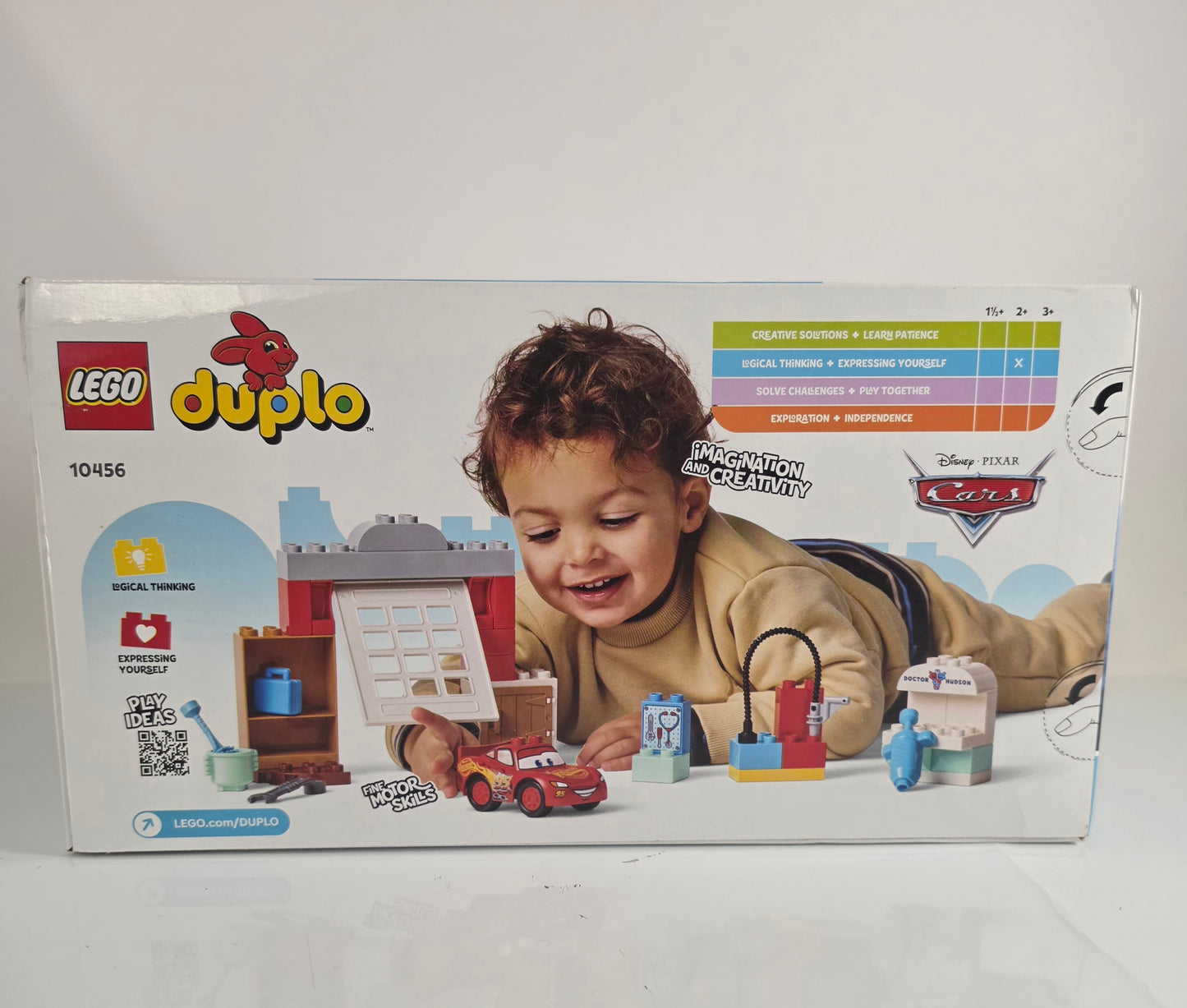 LEGO Duplo toy set packaging with a child playing on a white background
